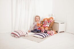 Panenka Bigjigs Toys látková Melody, 34 cm