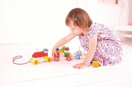 Hračka Bigjigs Toys Baby Dřevěný vláček s nasazováním