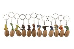 Přívěsek na klíče/Klíčenka dinosaurus ve vajíčku kov/plast 6cm mix druhů 12ks na kartě